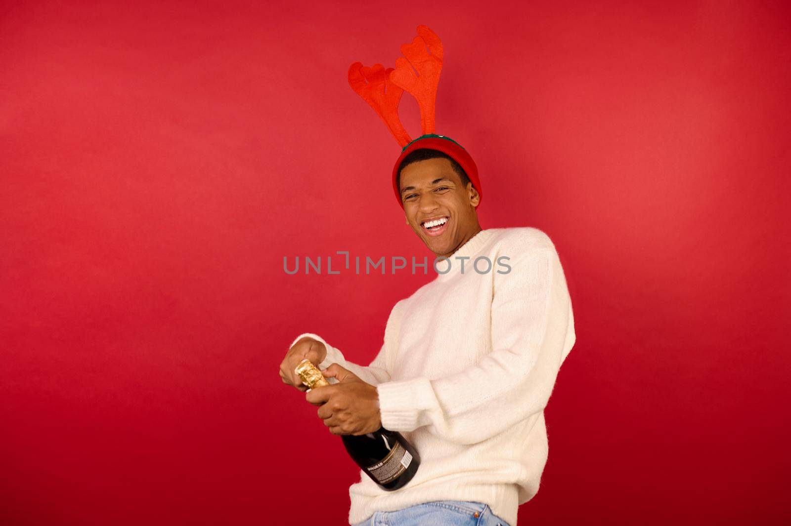 Xmas.mood. A man in horned hat having fun and smiling