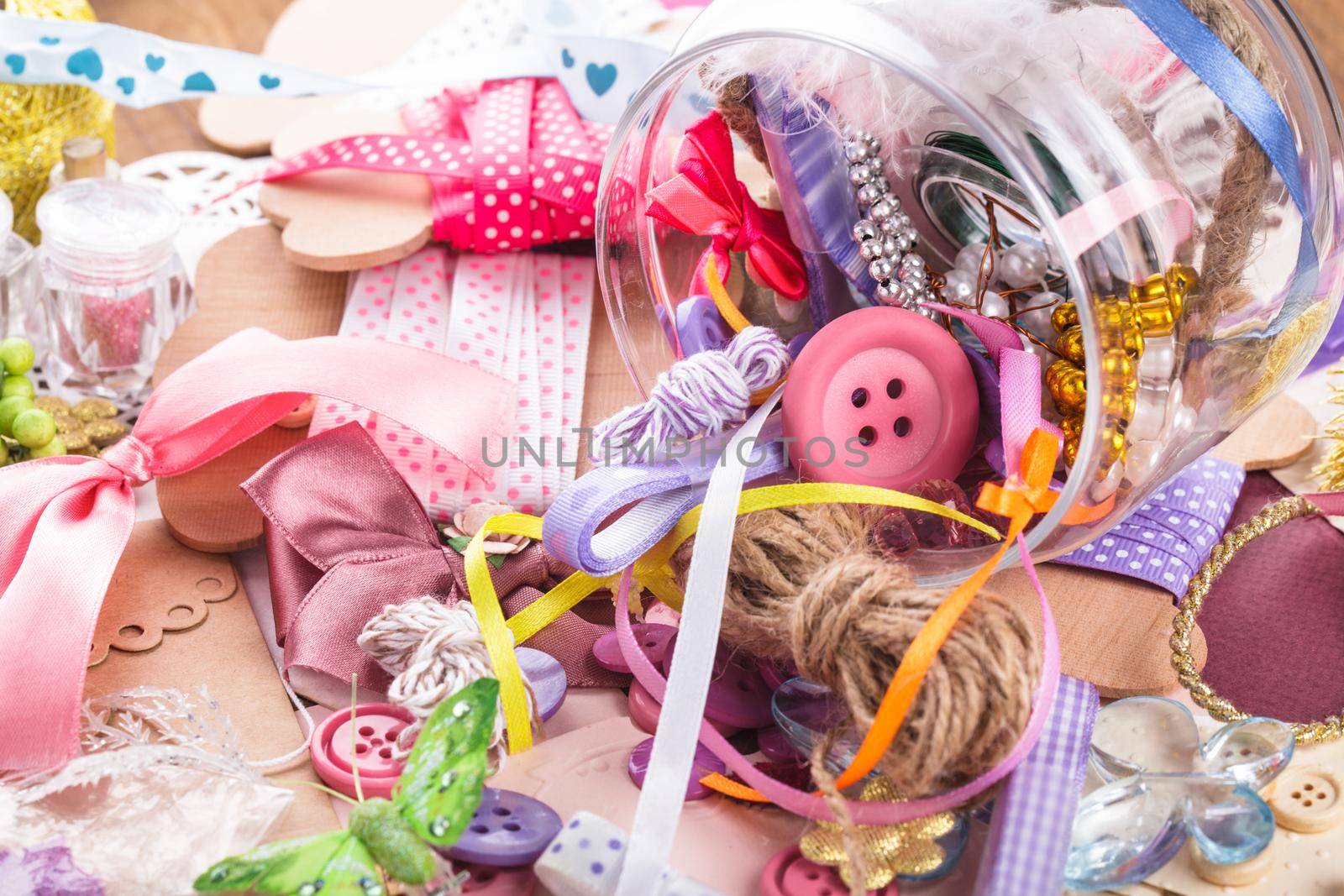 Scrapbooking craft materials in a glass bottle