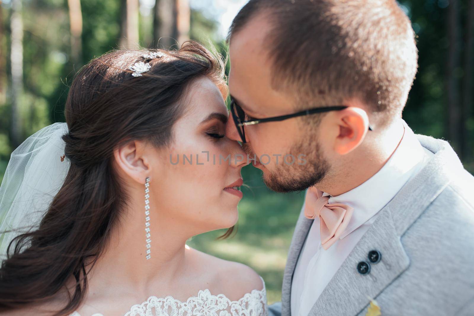 Wedding photography kiss bride and groom in different locations.