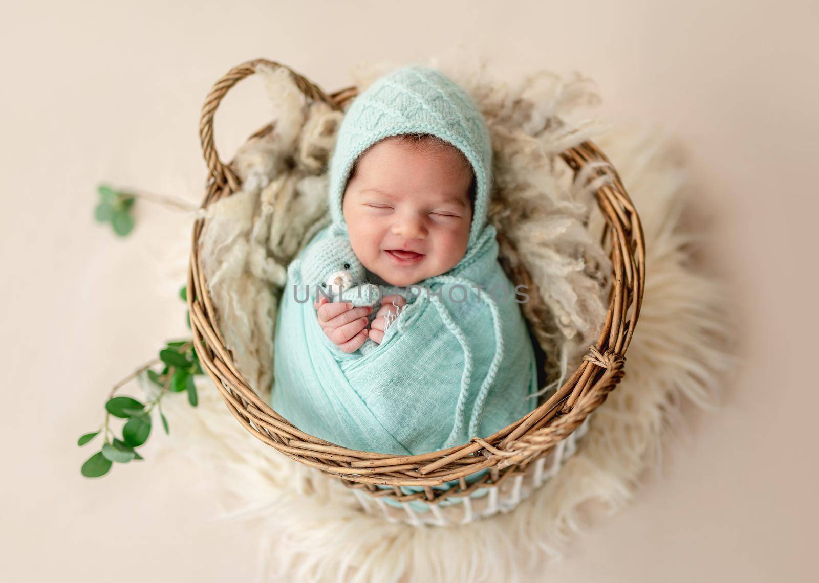 Funny newborn smiling in sweet dream