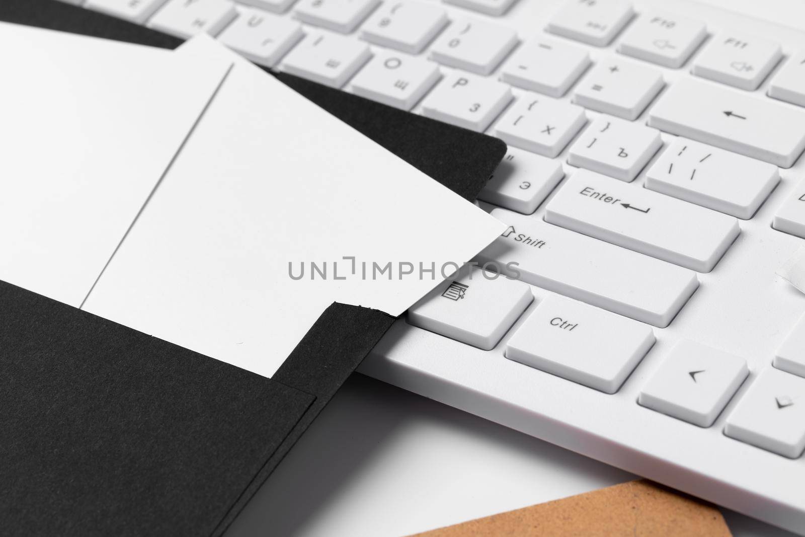 Blank business cards with supplies and keyboard on office table. by Fabrikasimf