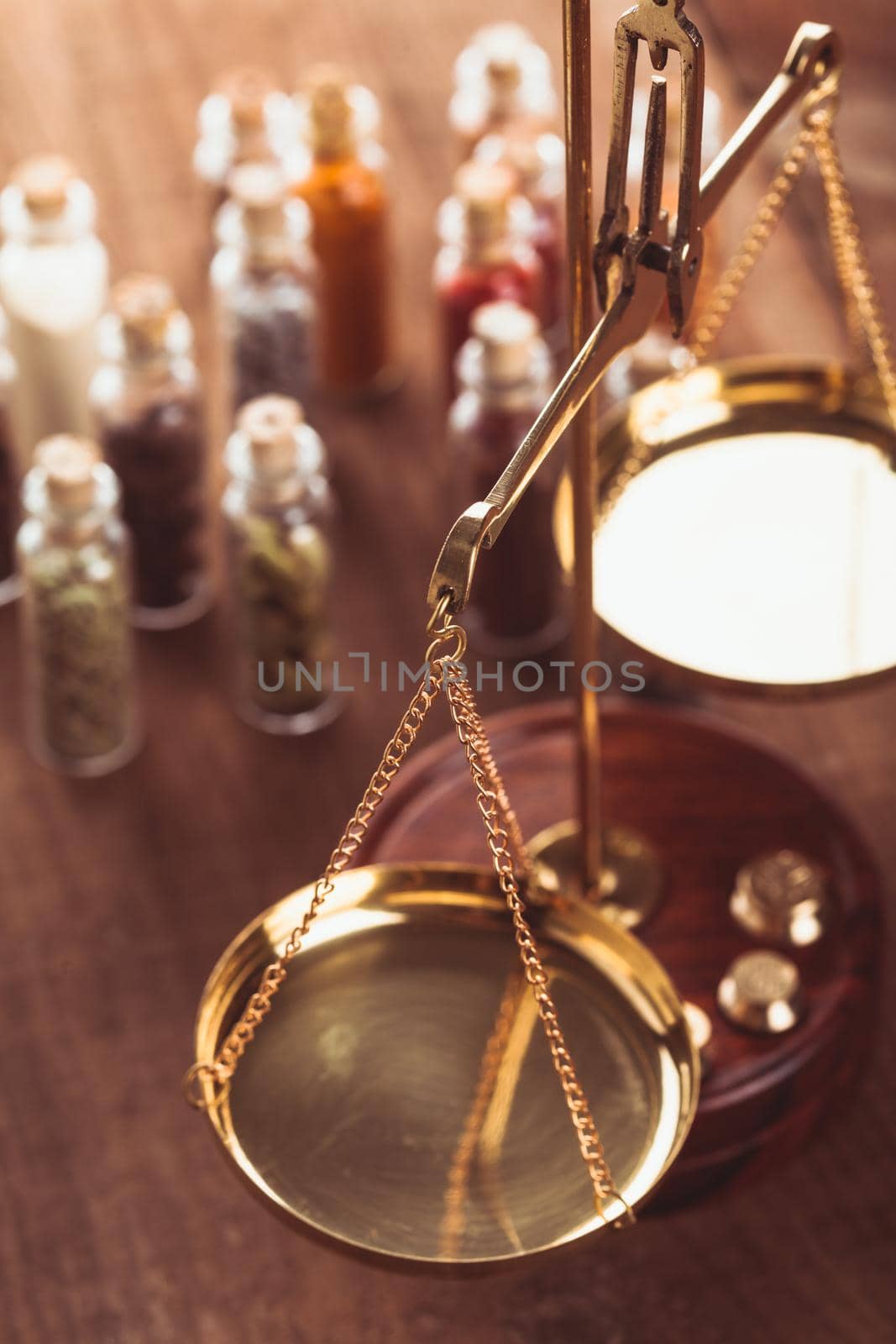 Little bottles with spices and scales on the table
