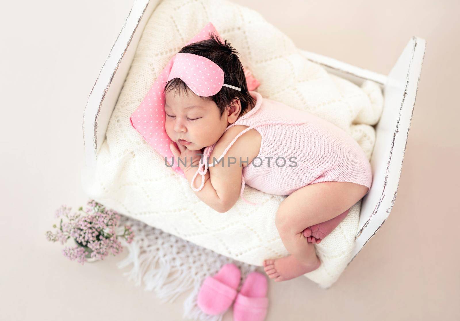 Charming newborn with pink sleep mask by tan4ikk1