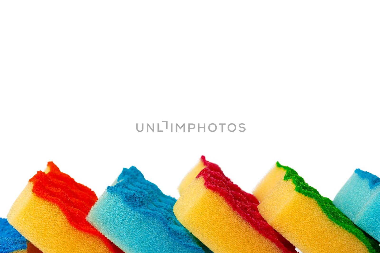 Stack of kitchen sponges isolated on white background, close up