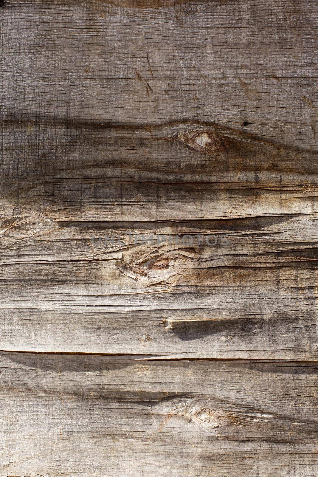 Retro wooden background, cracked plywood wall under the sunshine