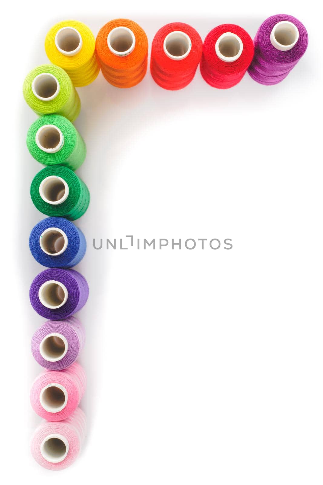 Sewing multicolored threads isolated on a white background