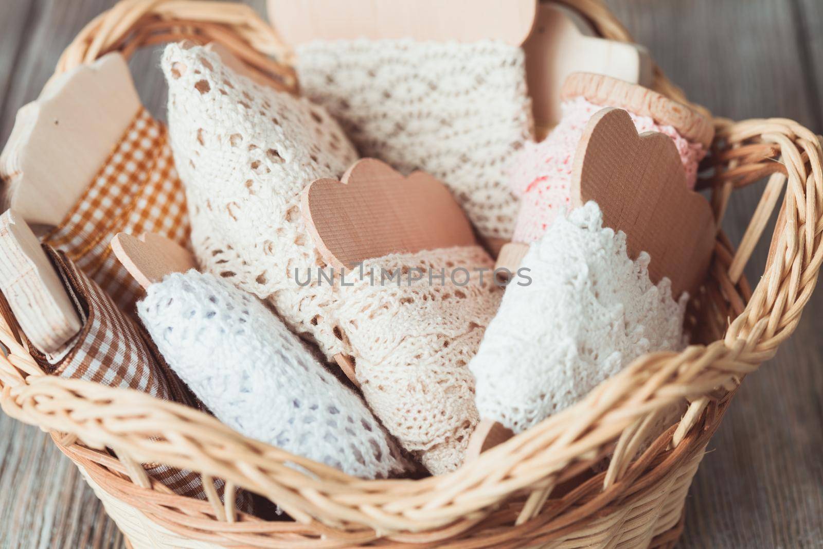 Vintage lace on the wooden bobbin in a basket