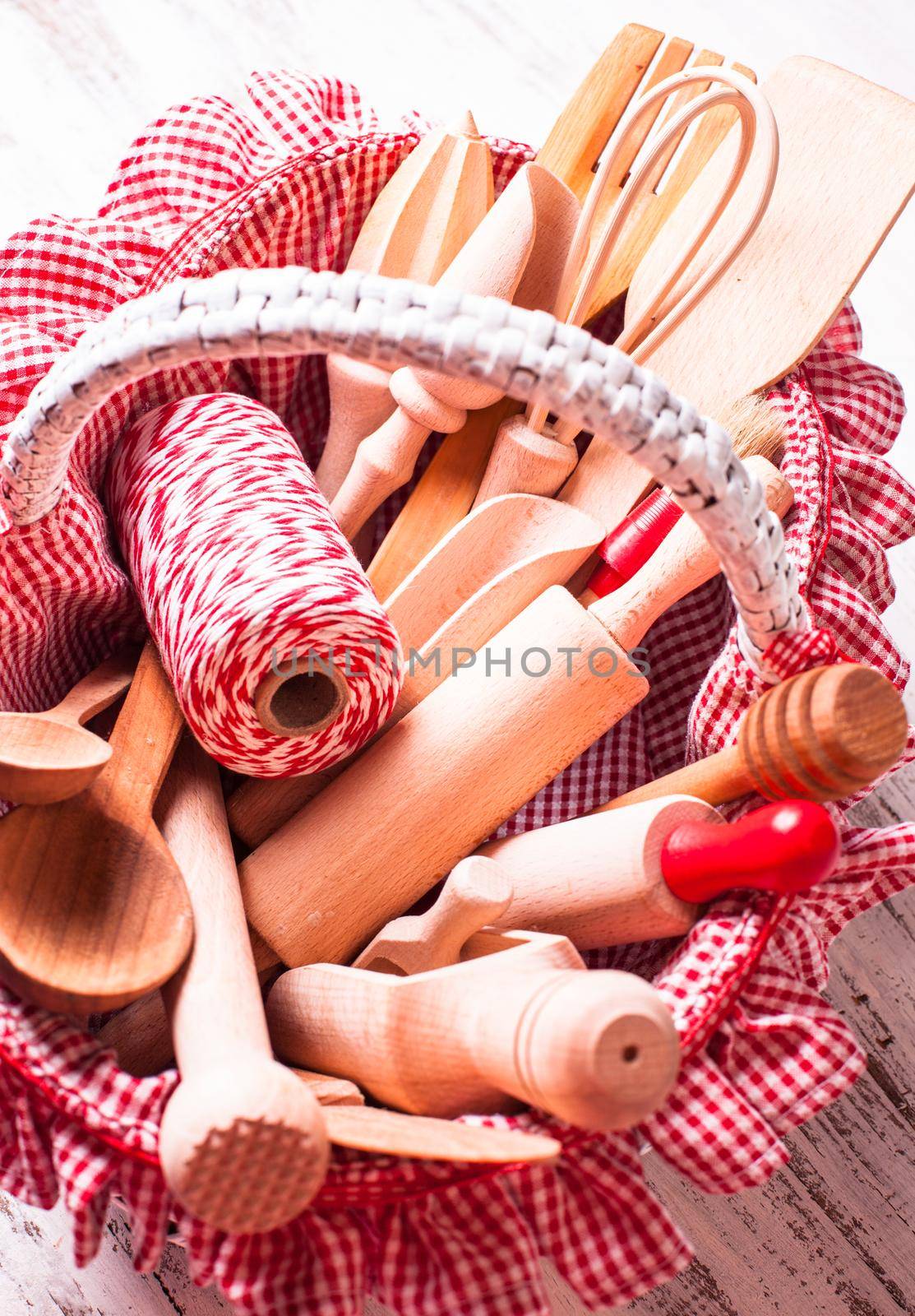 Shabby chic rustic basket with wooden kitchen utensils