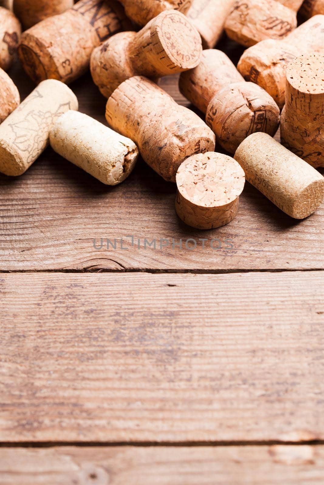 Corks on the wooden table. Wine and alcohol concept