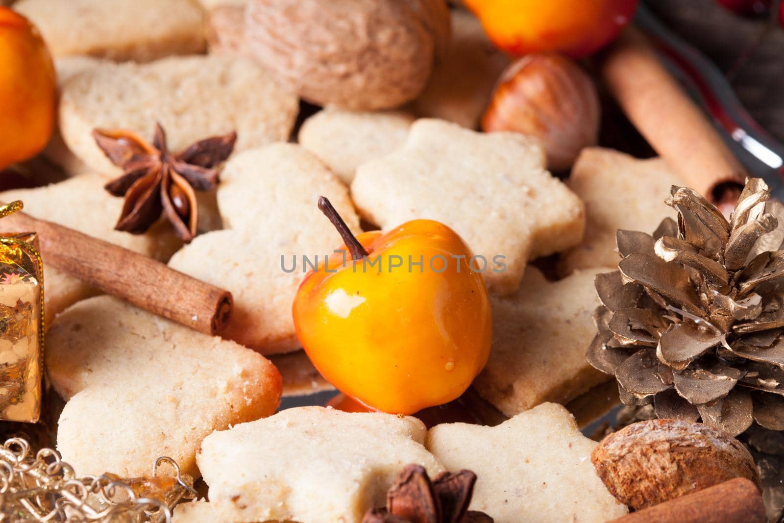 Christmas sweet decor - cookies, apple and spices on the tray