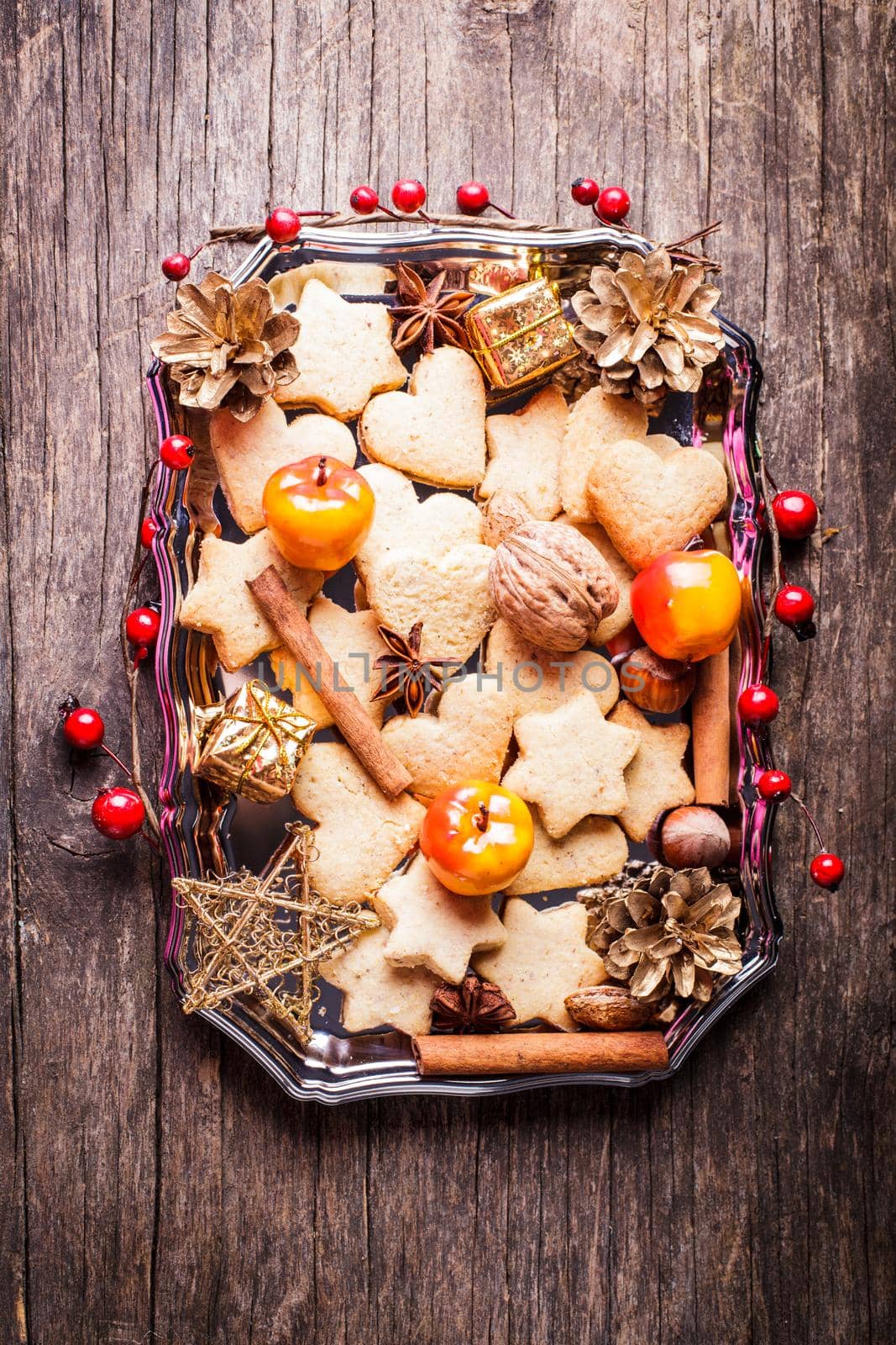 Christmas sweet decor - cookies, apple and spices on the tray