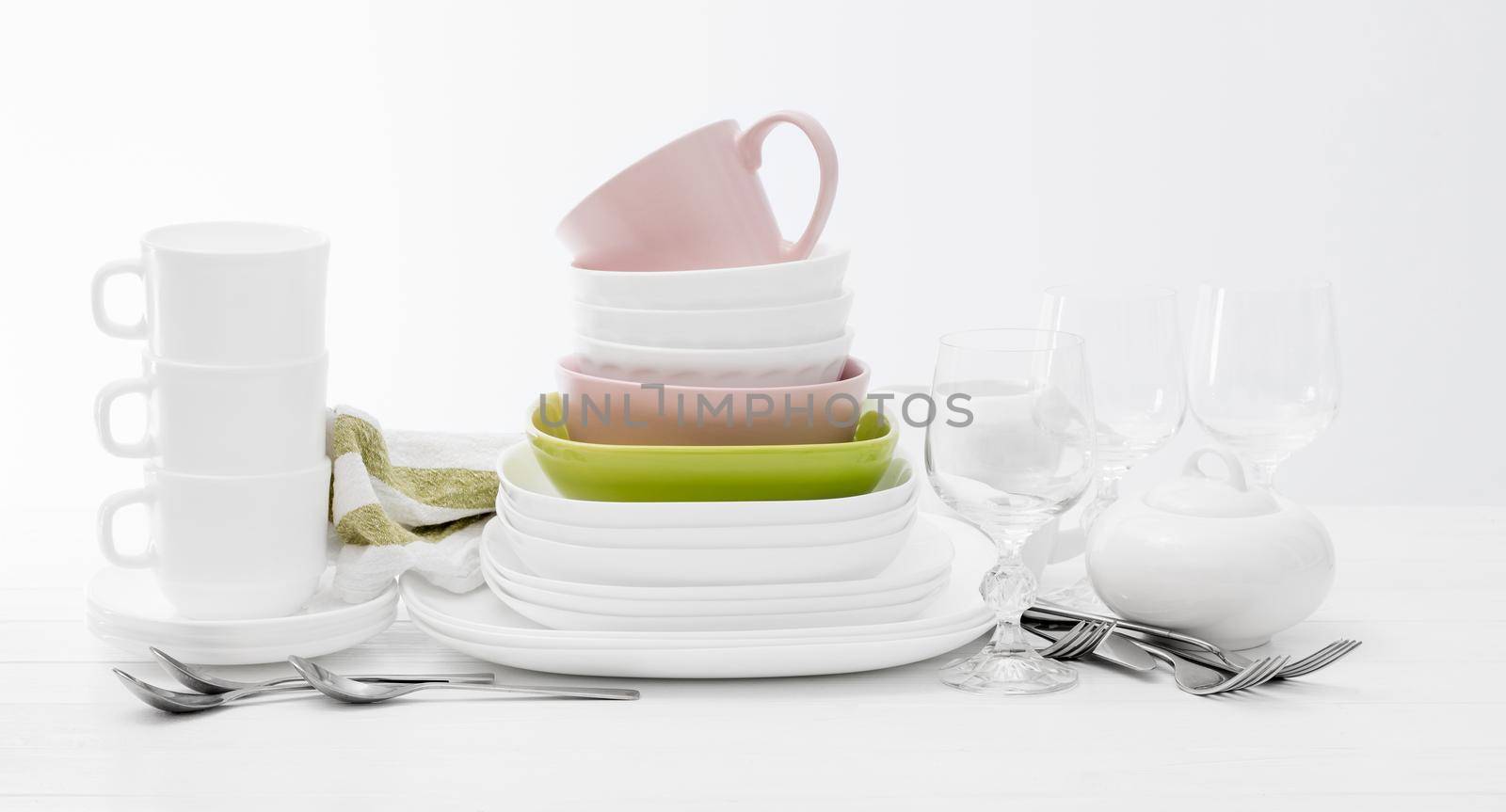 Pile of colourful square dishes and cups by tan4ikk1
