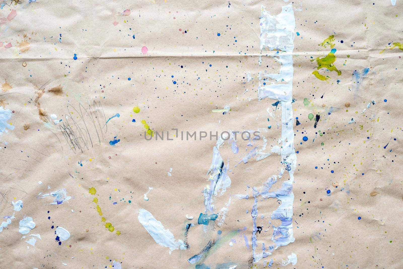 Abstract drawing of strokes and droplets at watercolor paper