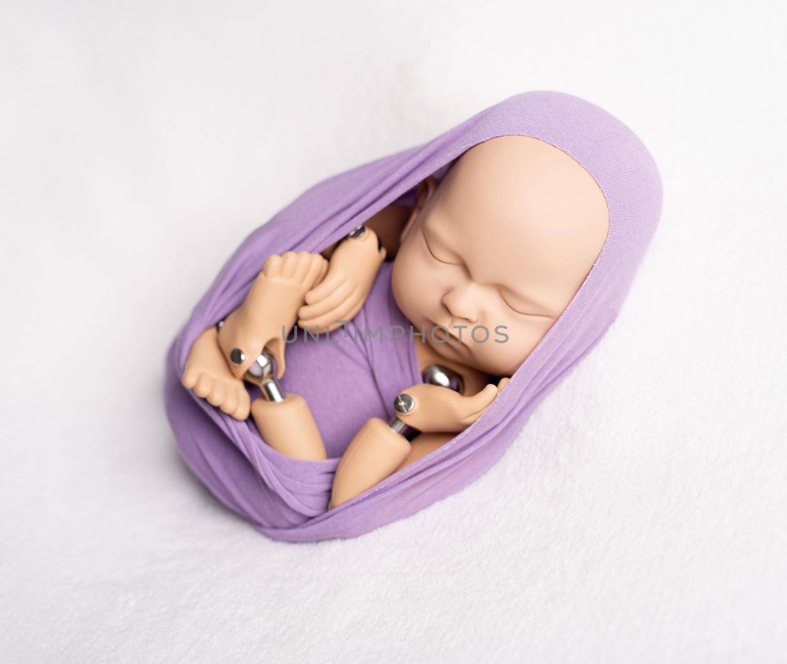Doll of newborn kid in sling by tan4ikk1