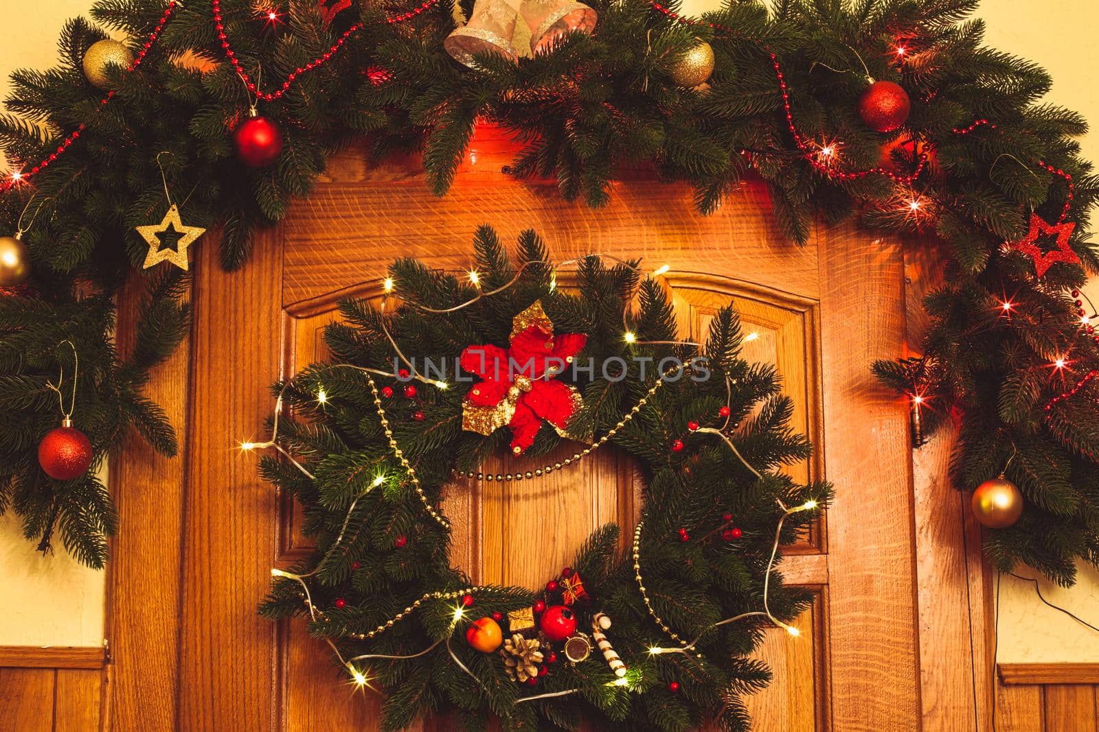 Christmas wreath with red sock and border on the door