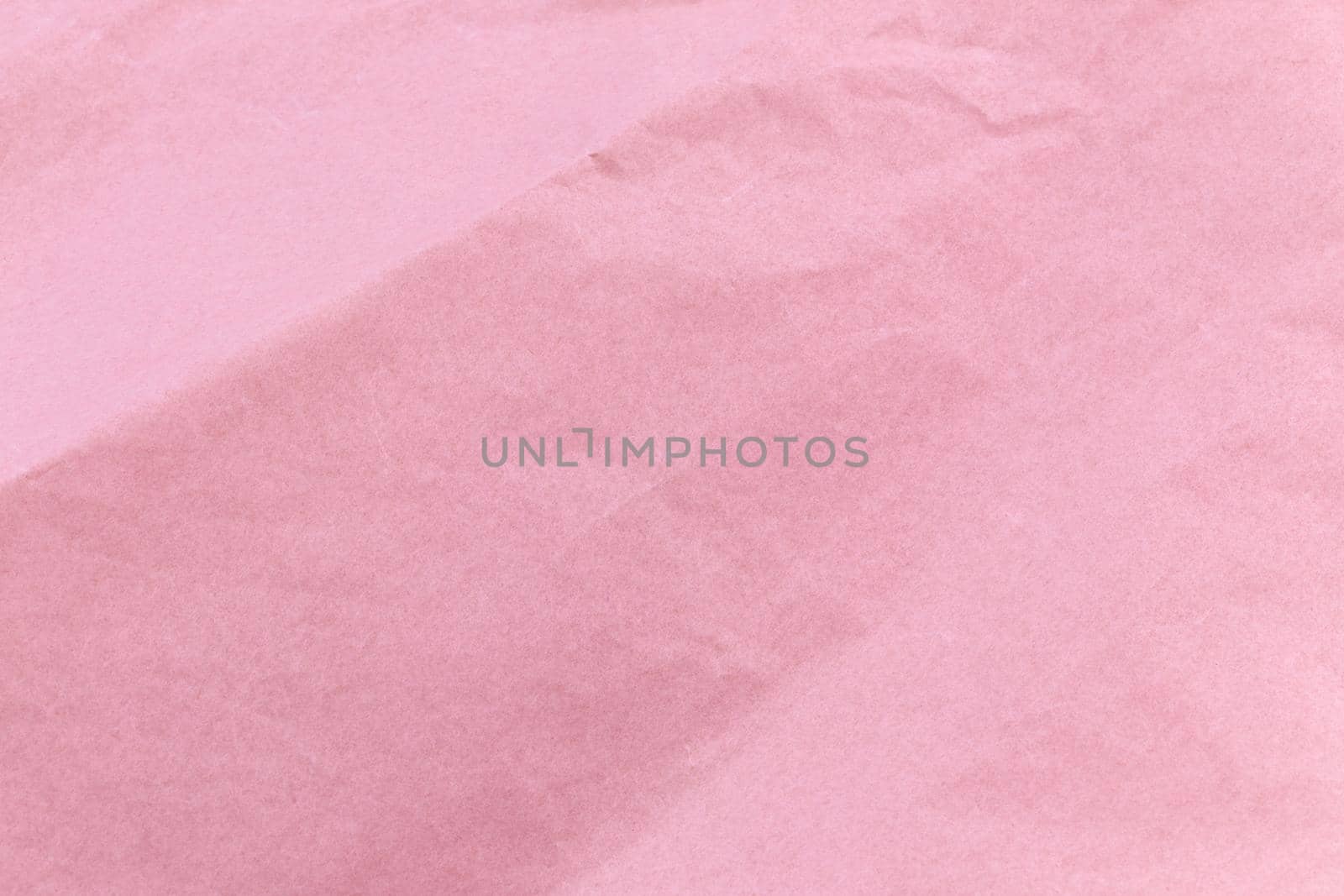 Texture of pink craft crumpled paper background.