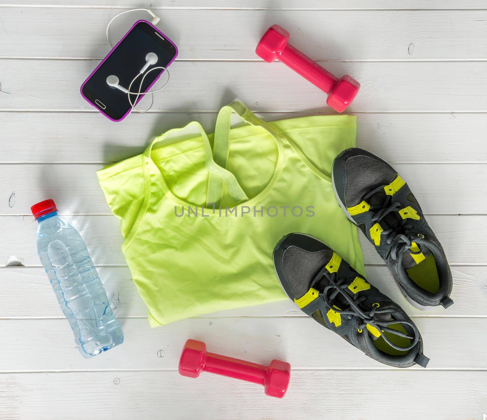 fitness items on wooden planks background top view