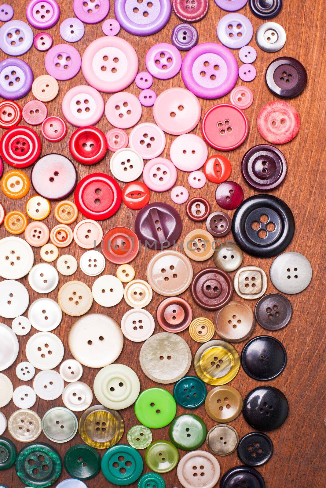 Colorful buttons as a rainbow background for design