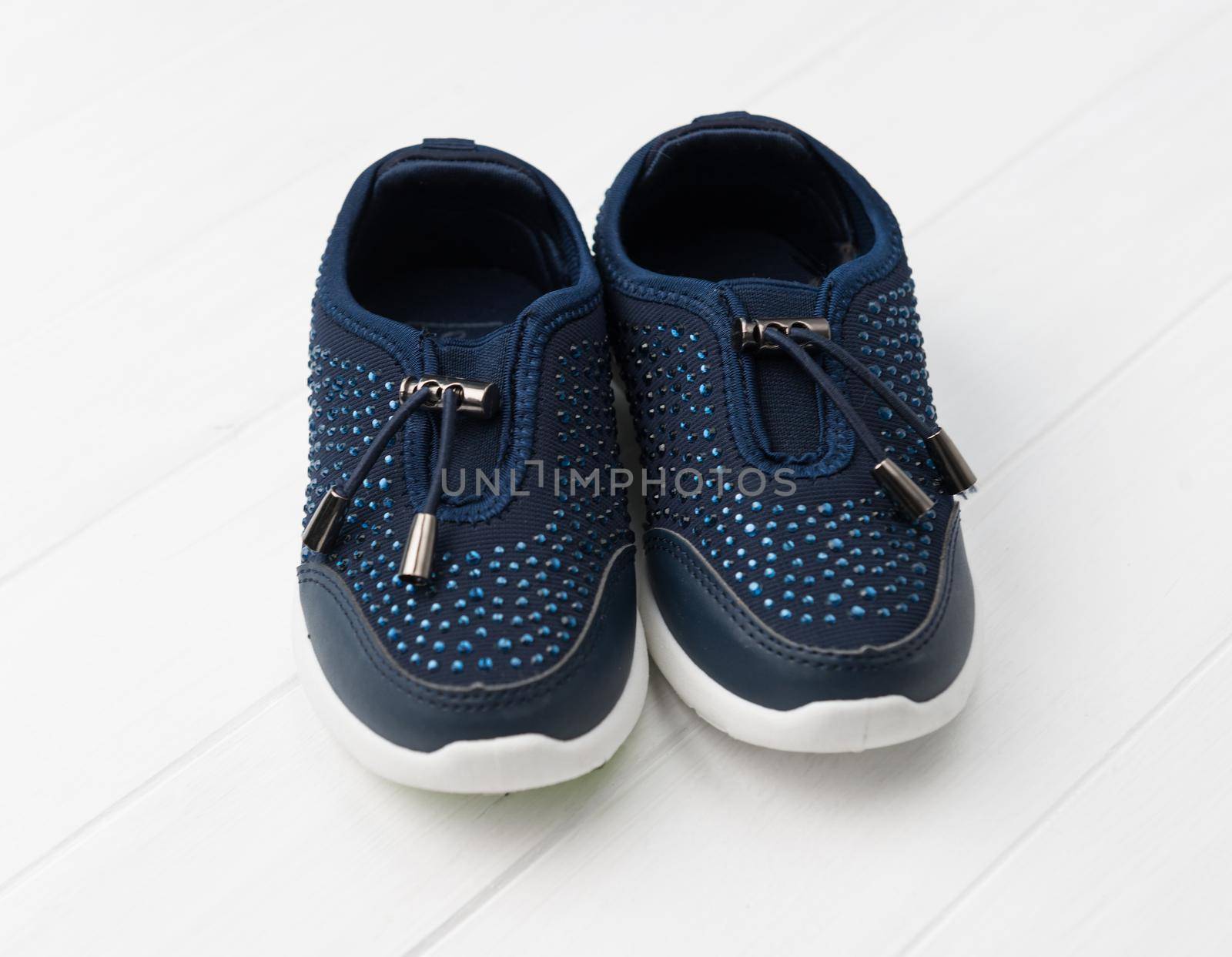 Dark blue sneakers with deep blue stones, white soles, comfy for running