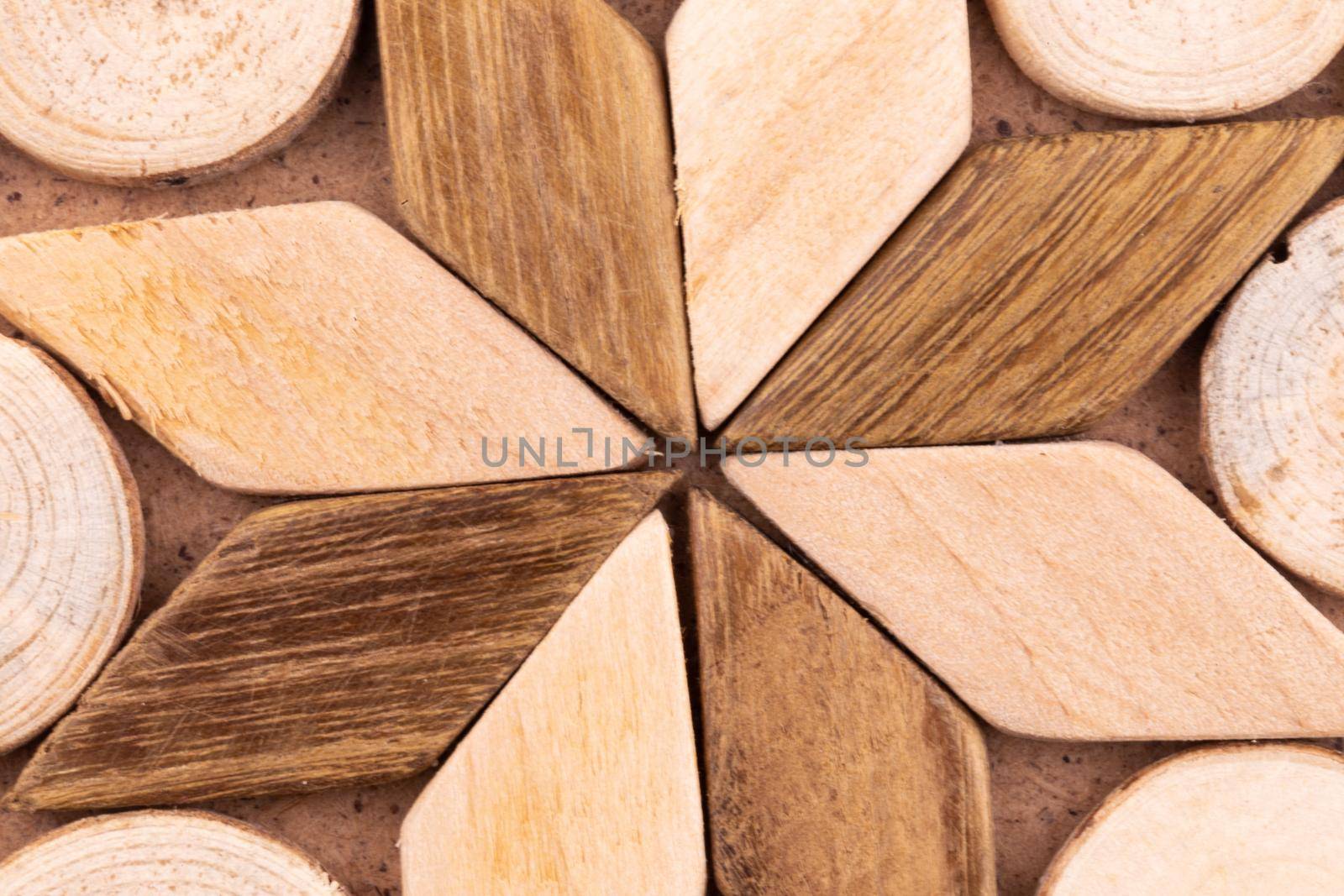 Abstract texture of a star made of wood and wood saw cut macro close-up background.