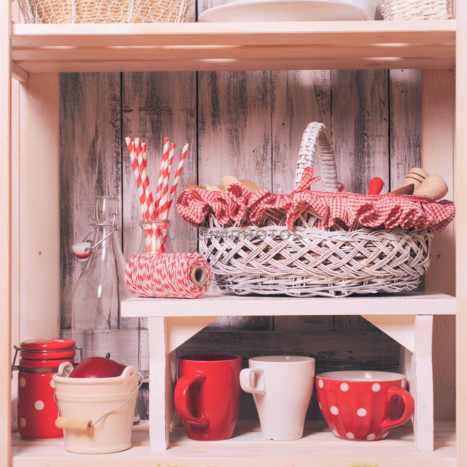 Shelves in the rack in the kitchen at shabby chic style