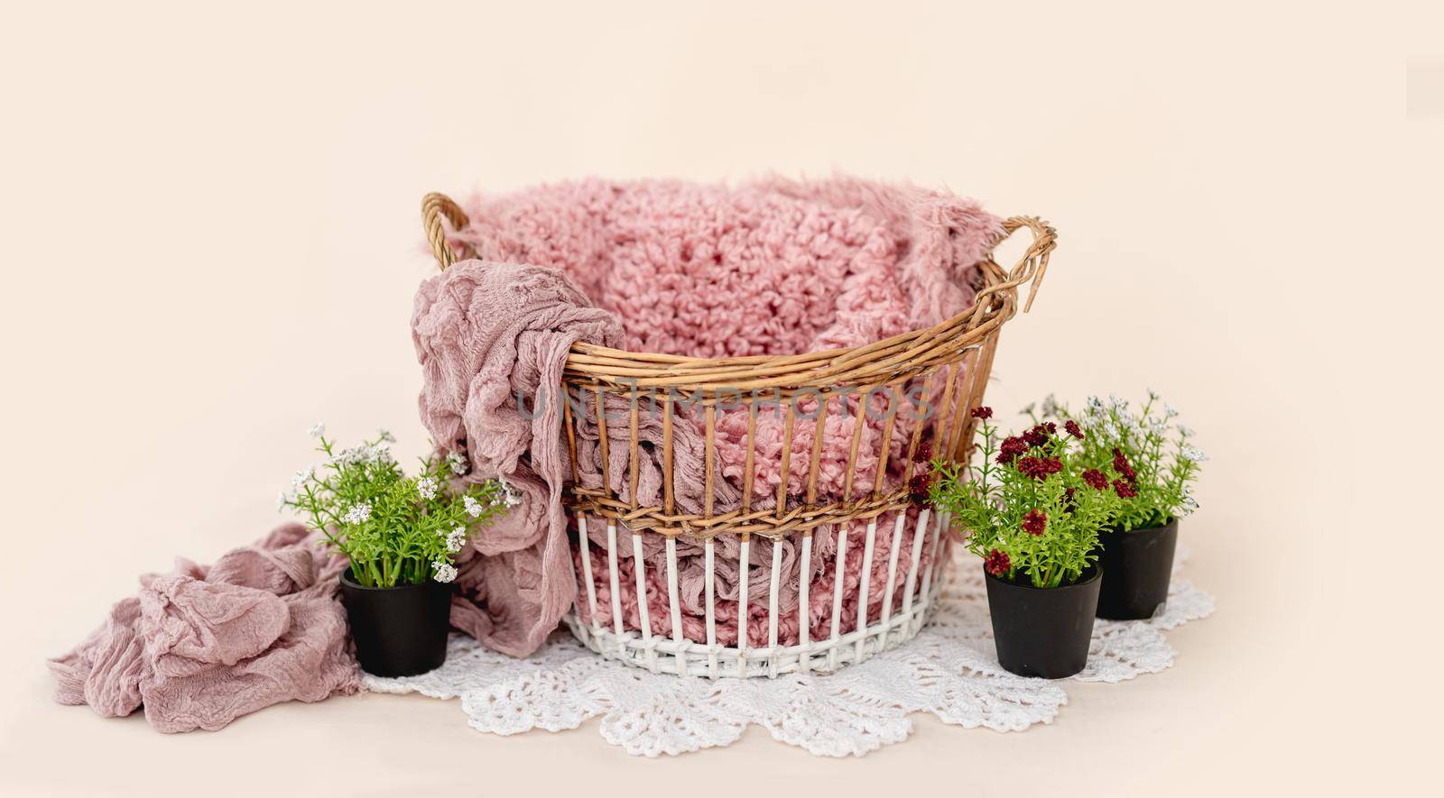 Cute newborn digital background for infant baby photosession. Wicker basket with knitted fabric and fur decorated plants