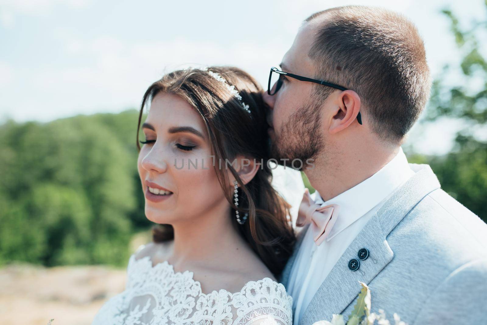 Wedding photography kiss bride and groom in different locations.