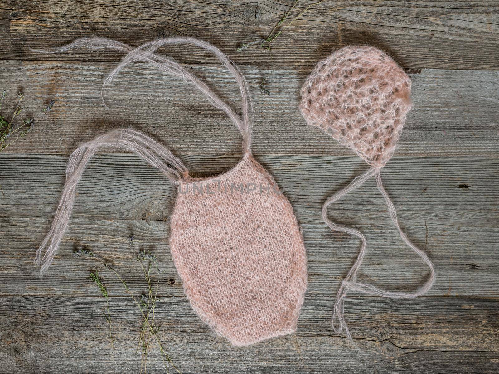 two little knitted pink woolen hats for newborn baby, top view