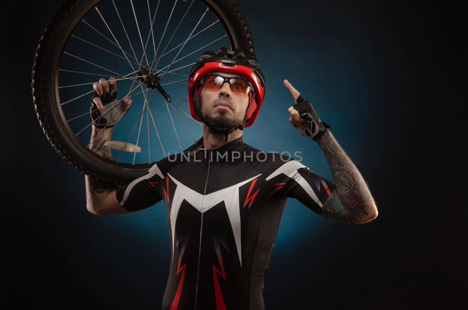 guy-cyclist in a Bicycle helmet with a Bicycle wheel by Rotozey