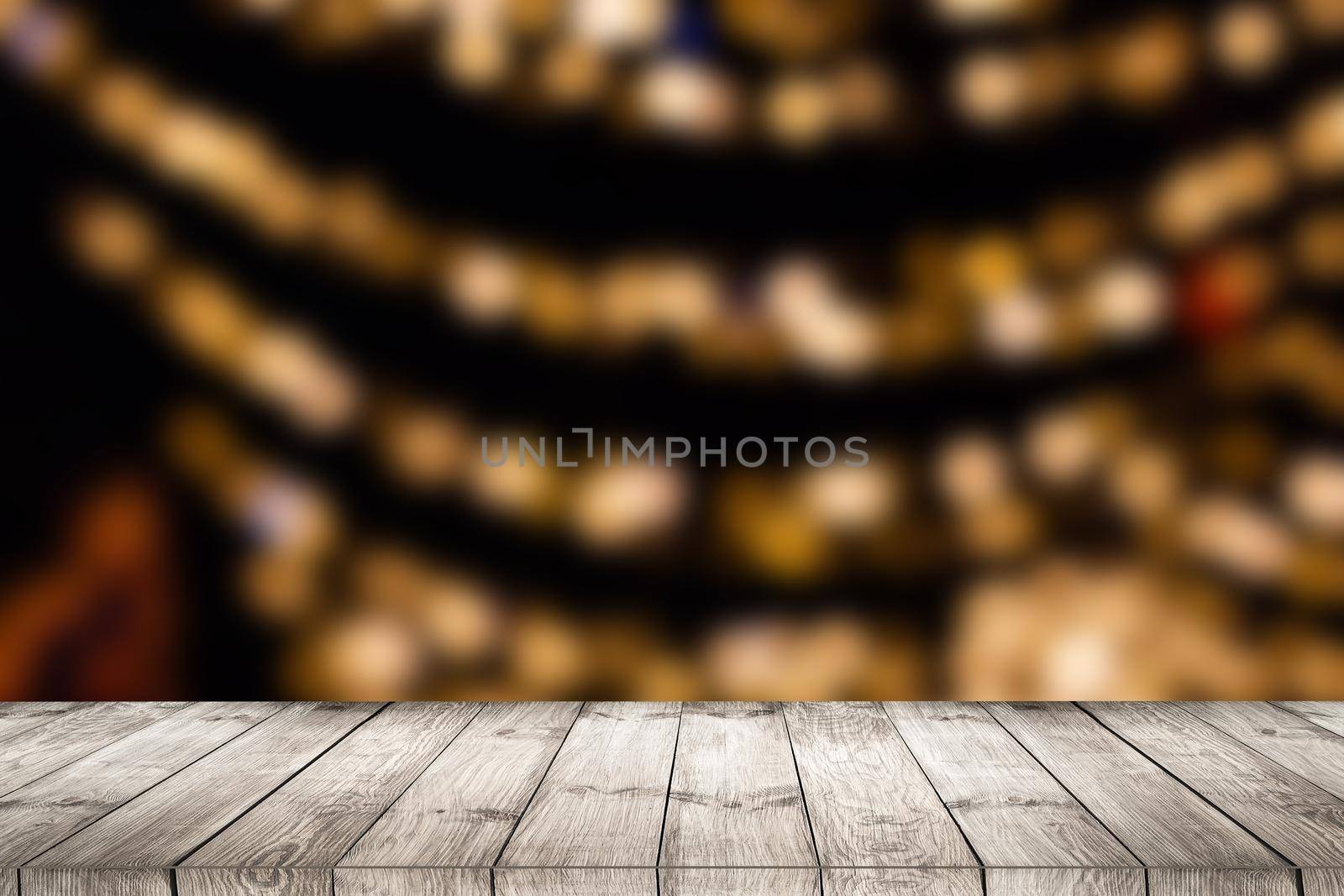 empty wooden floor or wooden terrace with abstract night light bokeh of night festival, blurred background, copy space for display of product or object presentation, vintage color tone.