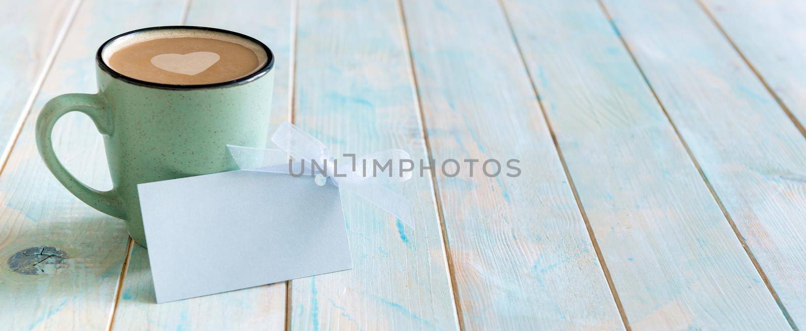 Cup of cappuccino with gift card label by tan4ikk1