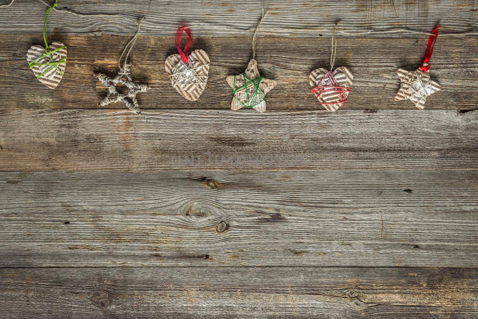 christmas handmade decorations on old wooden background by tan4ikk1