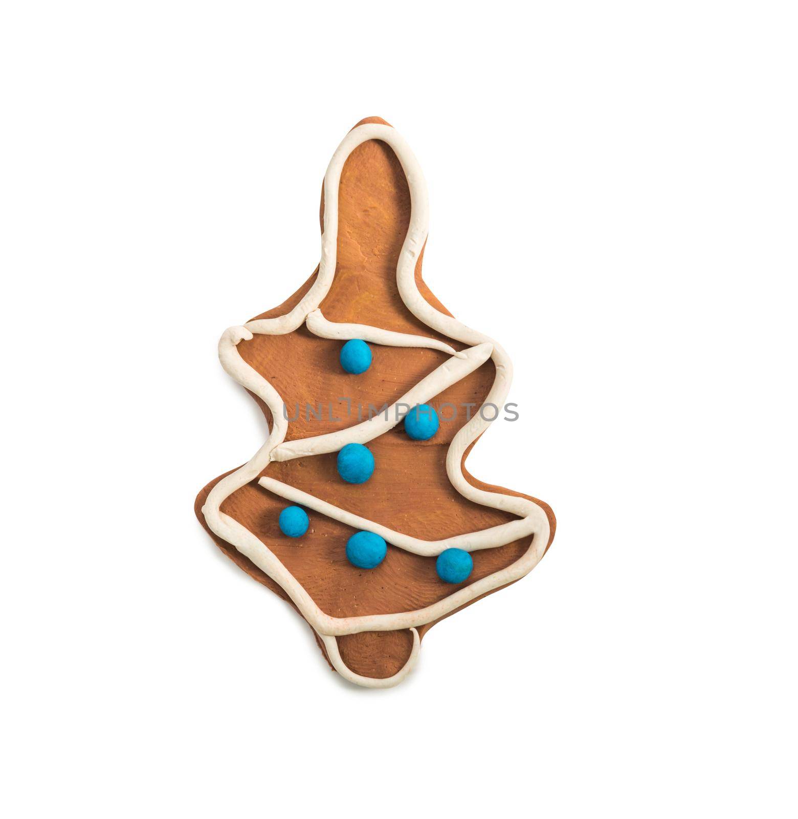 plasticine figure in a gingerbread shape of christmas tree isolated on white background