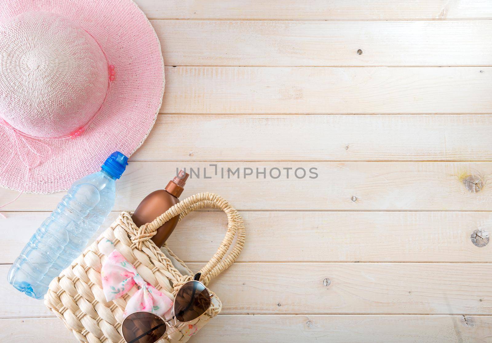 beach accessories on a white wooden background