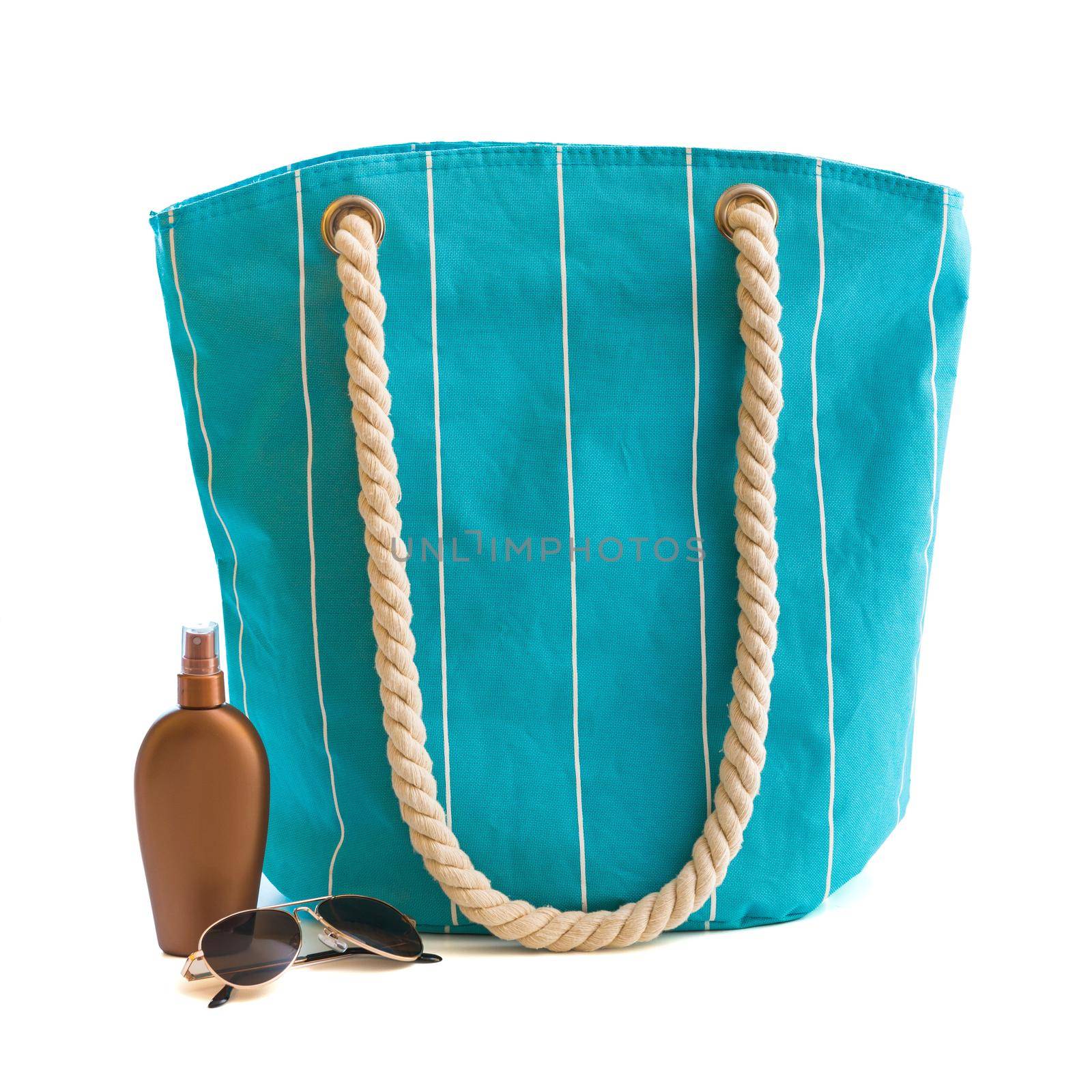 bag with beach accessories isolated on a white background