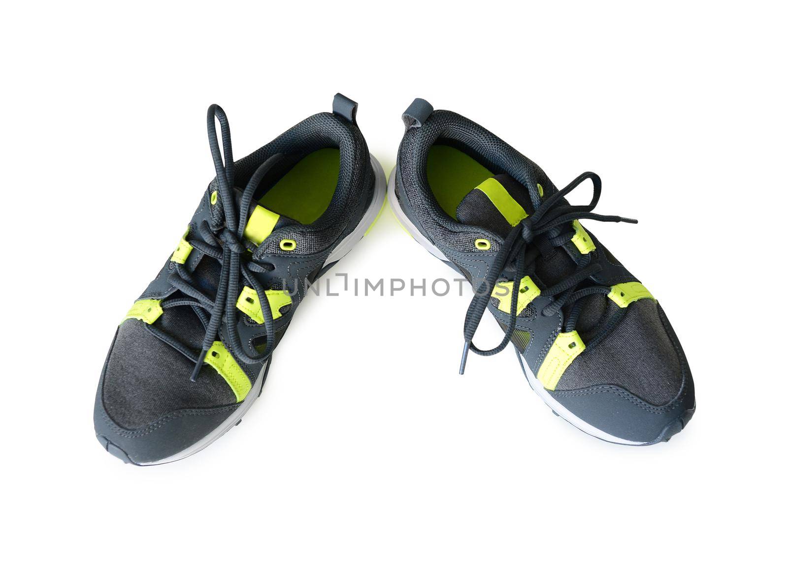 grey sneakers with neon green inserts isolated on white background