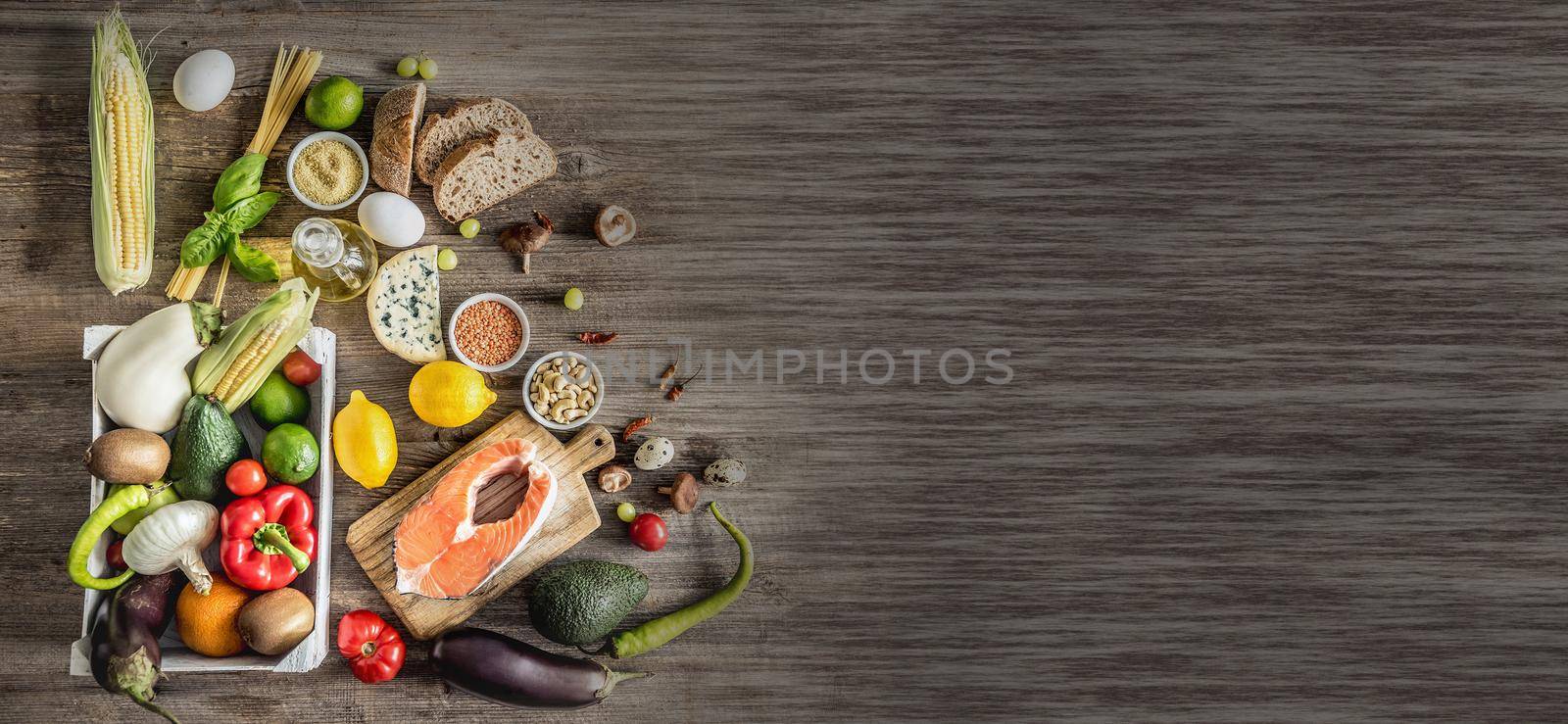 Healthy organic nutritious diet. Plenty of foods on the wooden table.