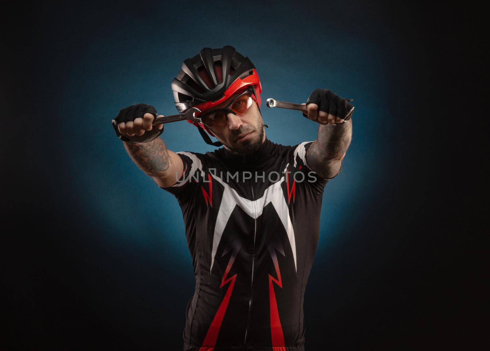 guy-cyclist in a Bicycle helmet with repair keys by Rotozey