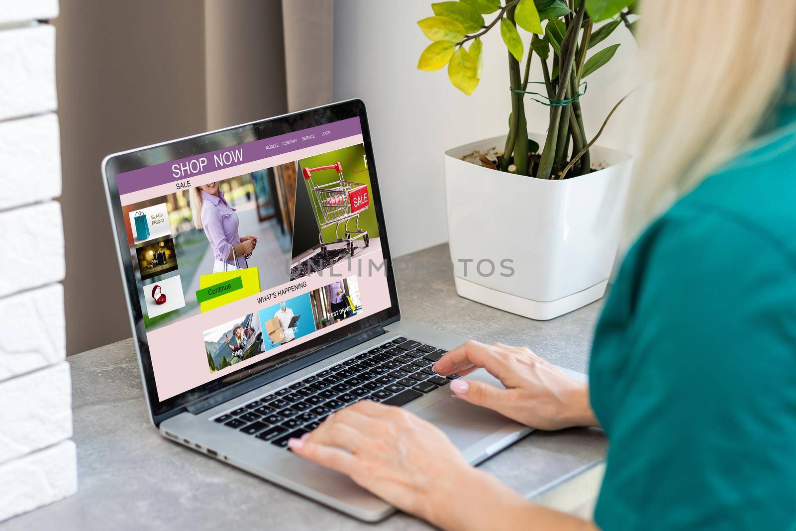 Woman shopping online using her laptop at home.