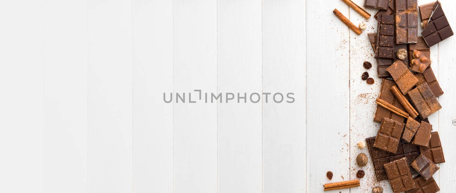 variety of chocolate on a wooden background with space for text