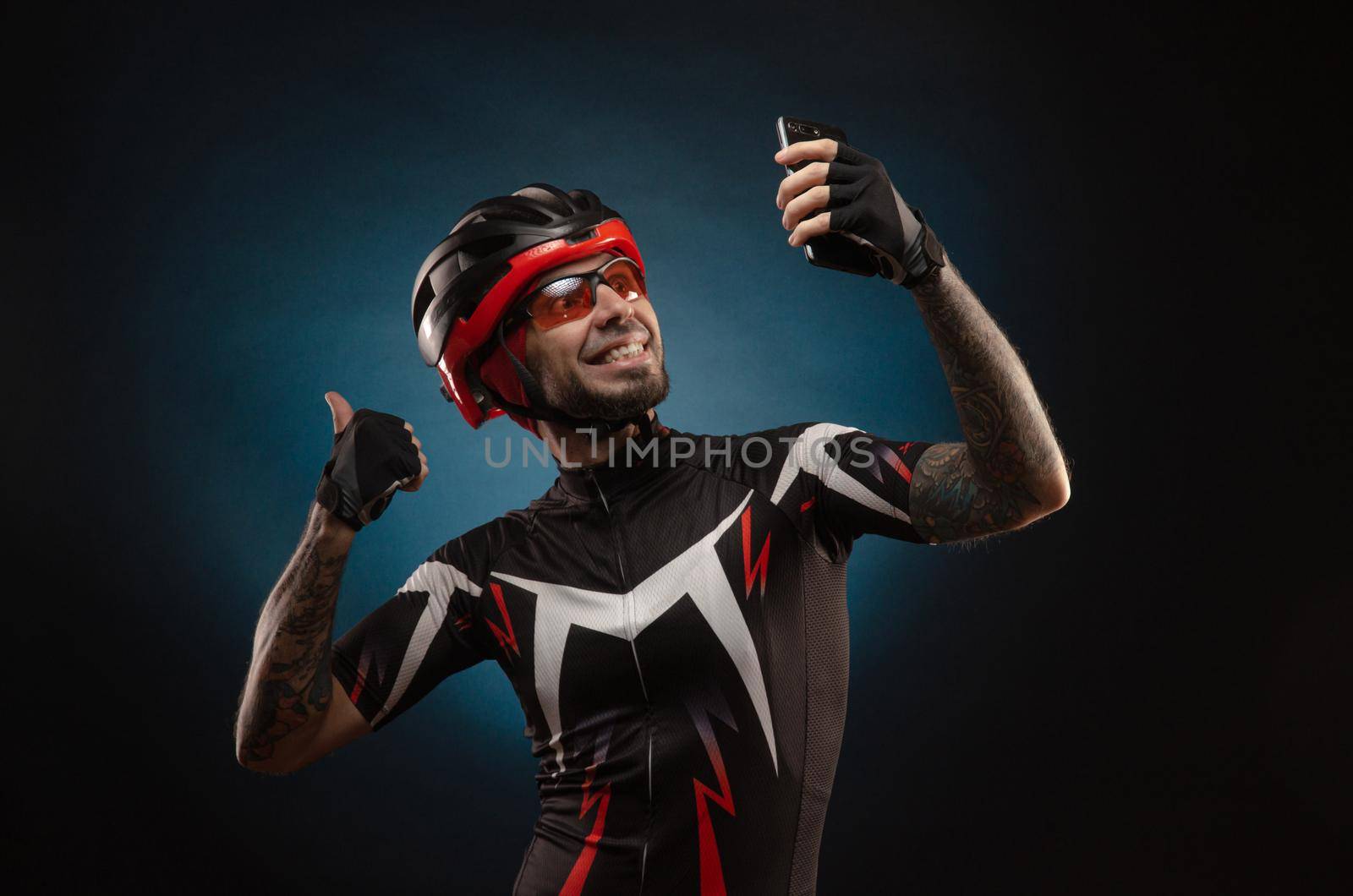 guy is a cyclist in a Bicycle helmet takes a selfie