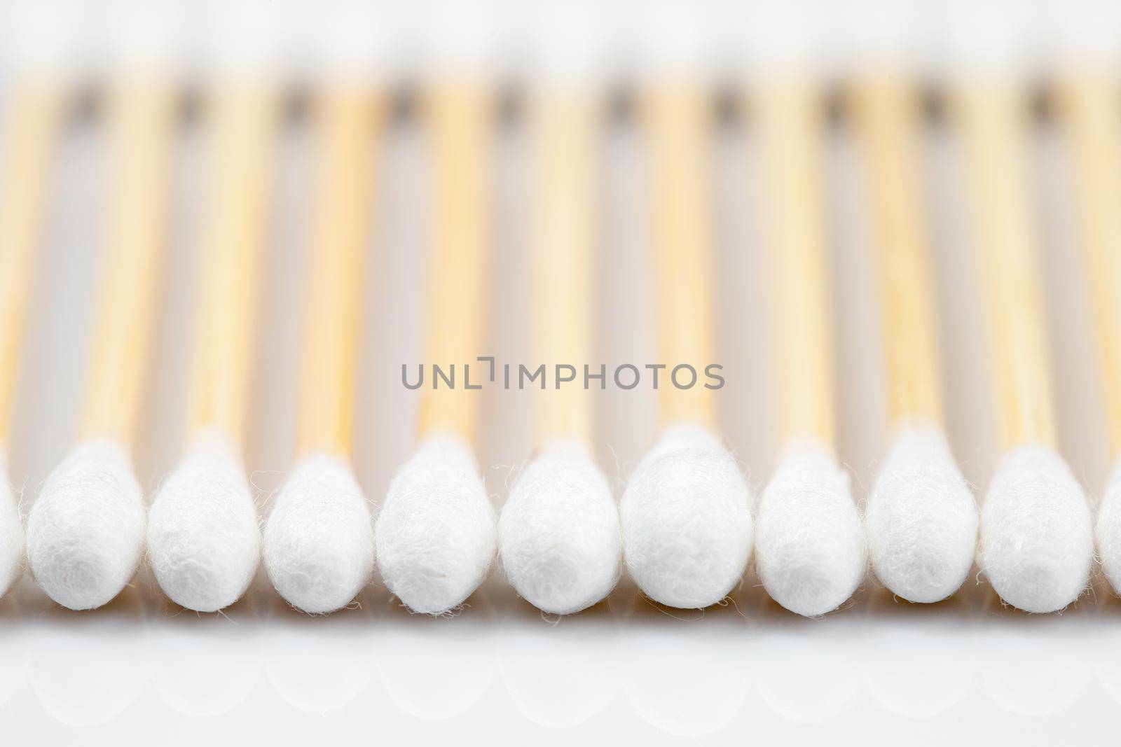 Zero waste bamboo cotton swabs on white background by Syvanych