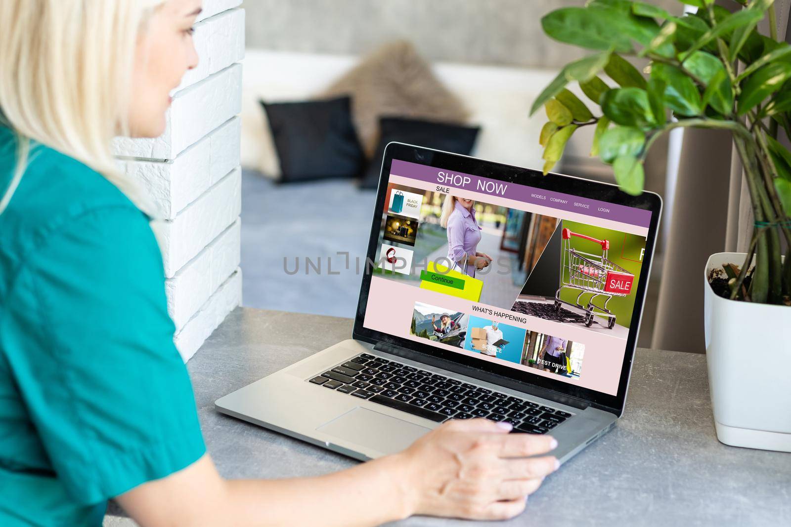 Young woman using laptop computer. Online shopping concept.