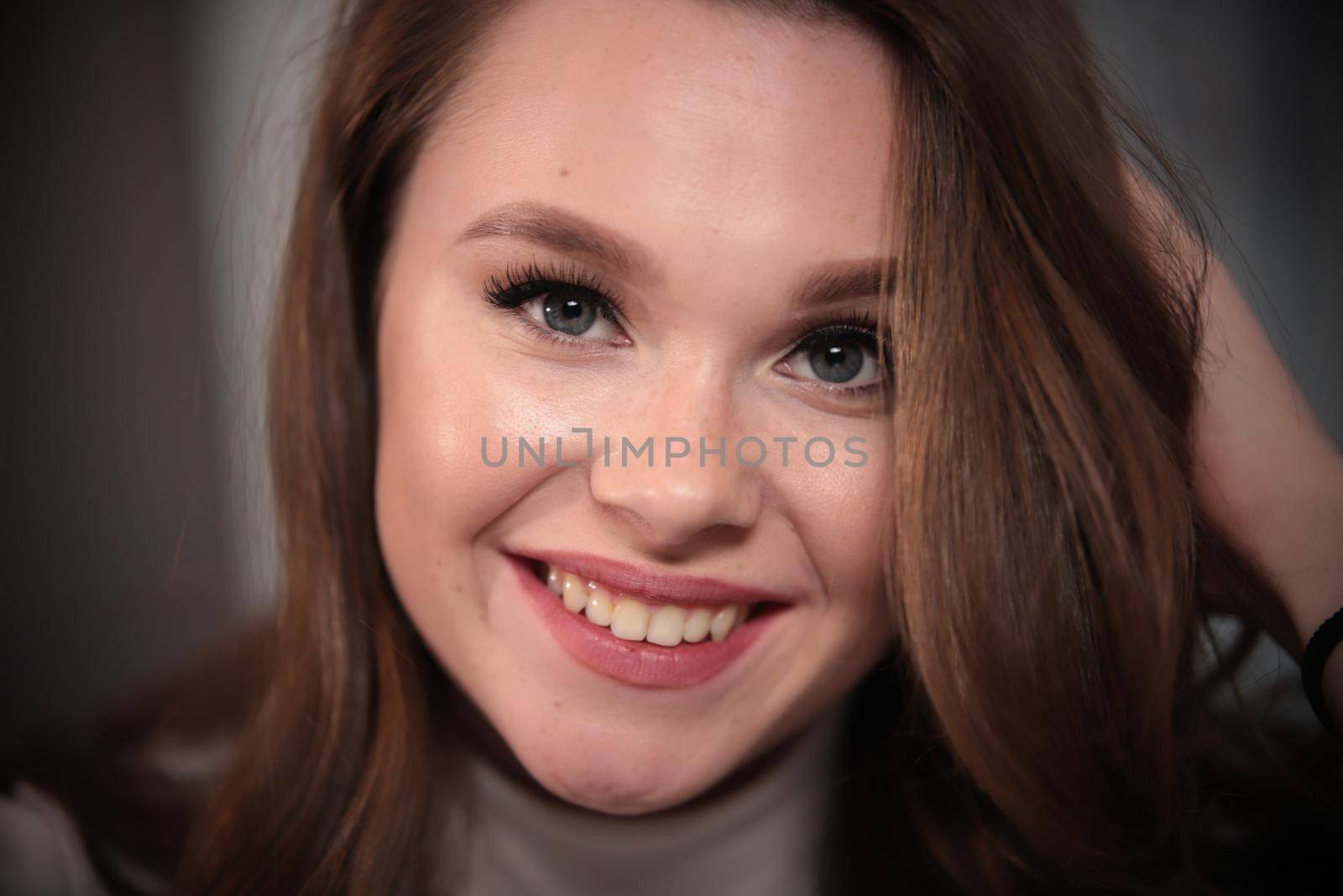 Portrait of young beautiful smiling woman . Close up shot