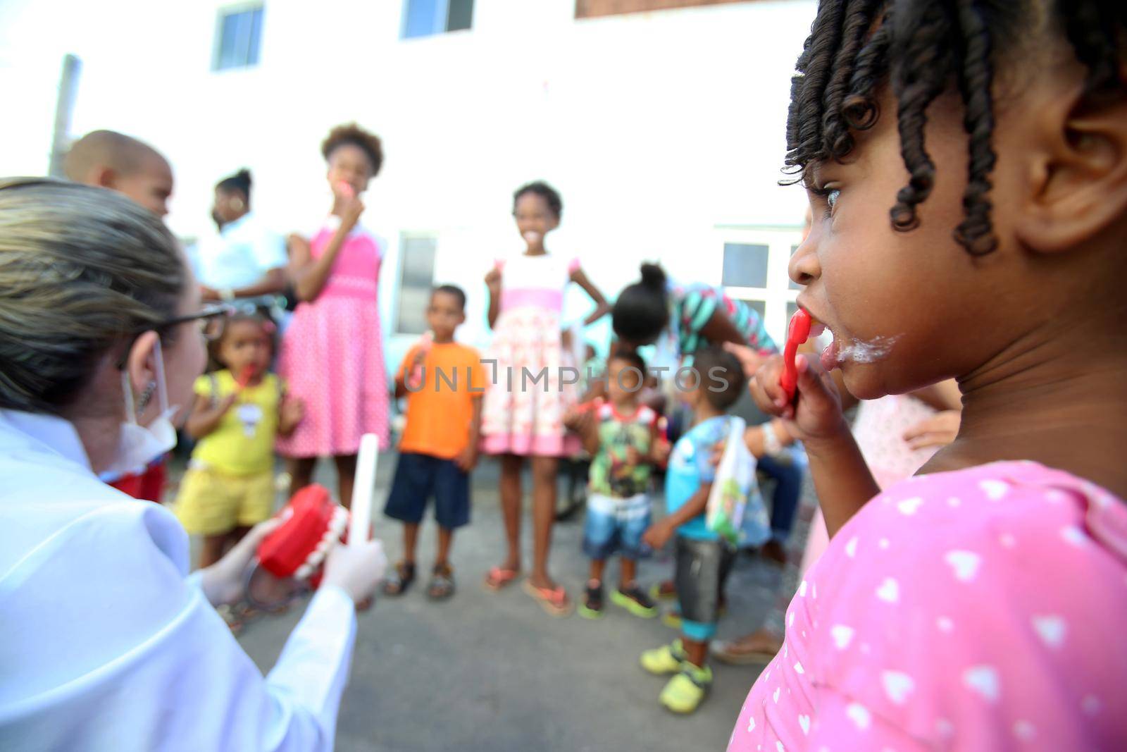 salvador, bahia, brazil - october 20, 2017:  dentita is tested in children's teething during social action in a daycare center in the city of Salvador.
