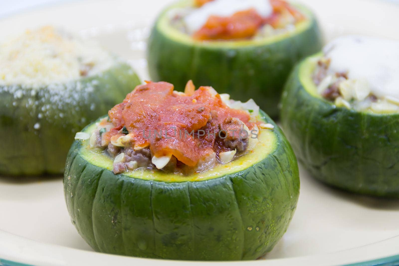 zucchini stuffed with meat and a variety of sauces