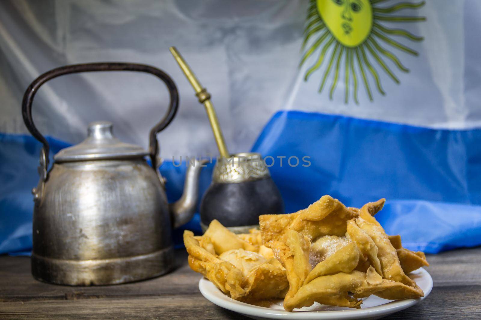 yerba mate, guitar and fried pastries, symbols of the Argentine tradition by GabrielaBertolini