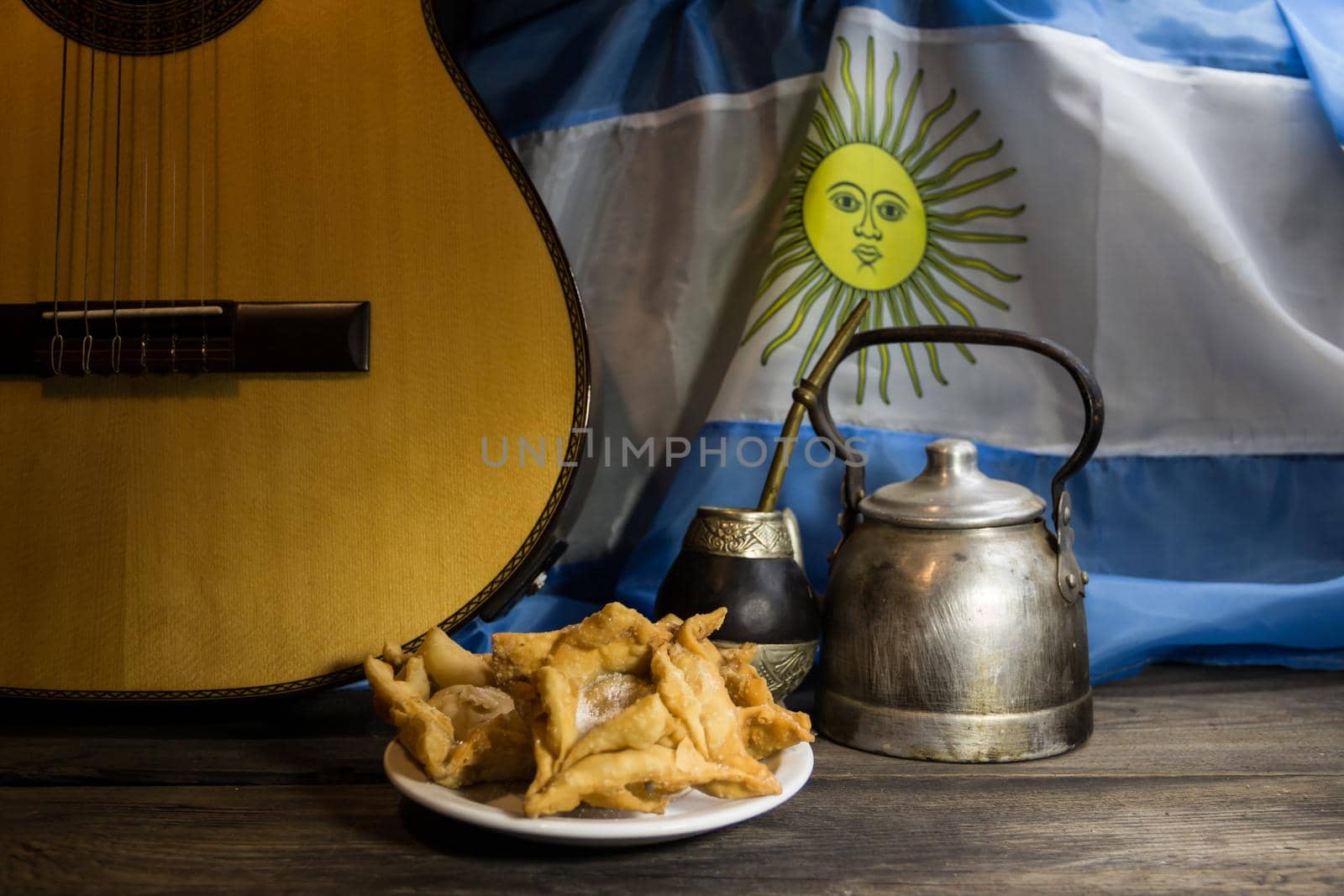yerba mate, guitar and fried pastries, symbols of the Argentine tradition by GabrielaBertolini