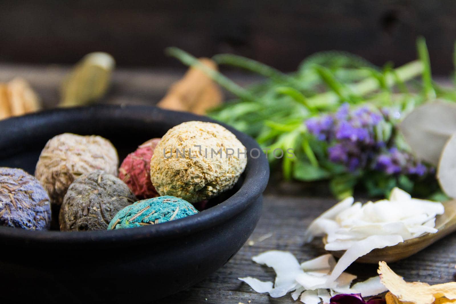 set of aromatic incense and natural flowers and herbs on rustic wood by GabrielaBertolini
