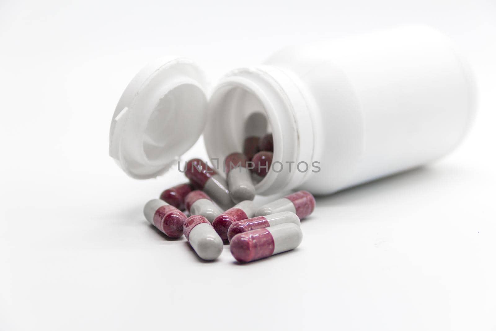 Detail of a bottle of capsules with medical drugs.Concept Medicine, health by GabrielaBertolini